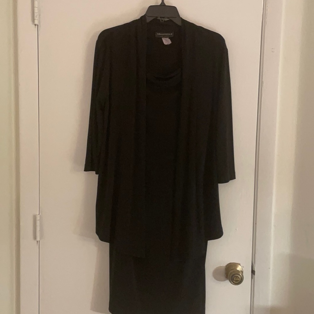 One piece black dress with attached jacket for extra styling.